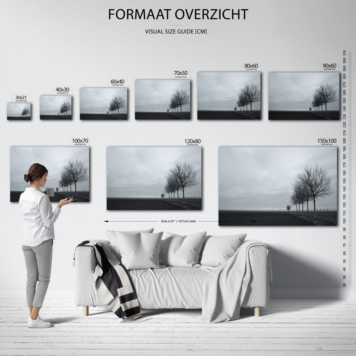 Landschap met bomen poster – sfeerbeeld – een rij kale bomen langs een pad in een uitgestrekt landschap onder een bewolkte