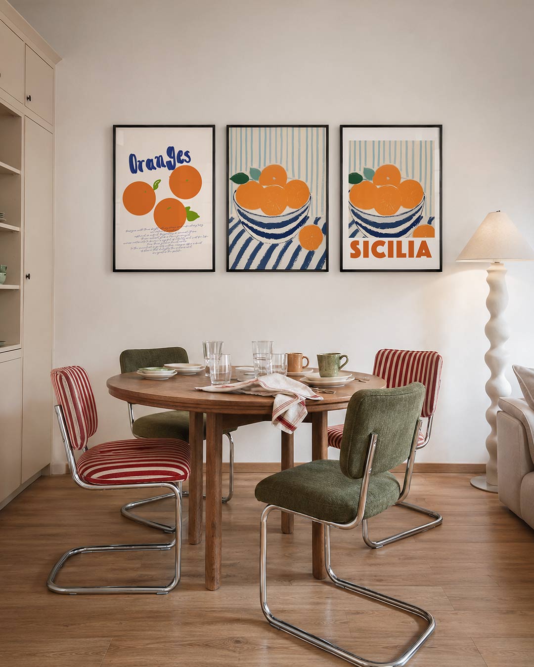 Fruitige kleurenpracht driedelige posterset – deze posterset toont drie levendige sinaasappels met groene