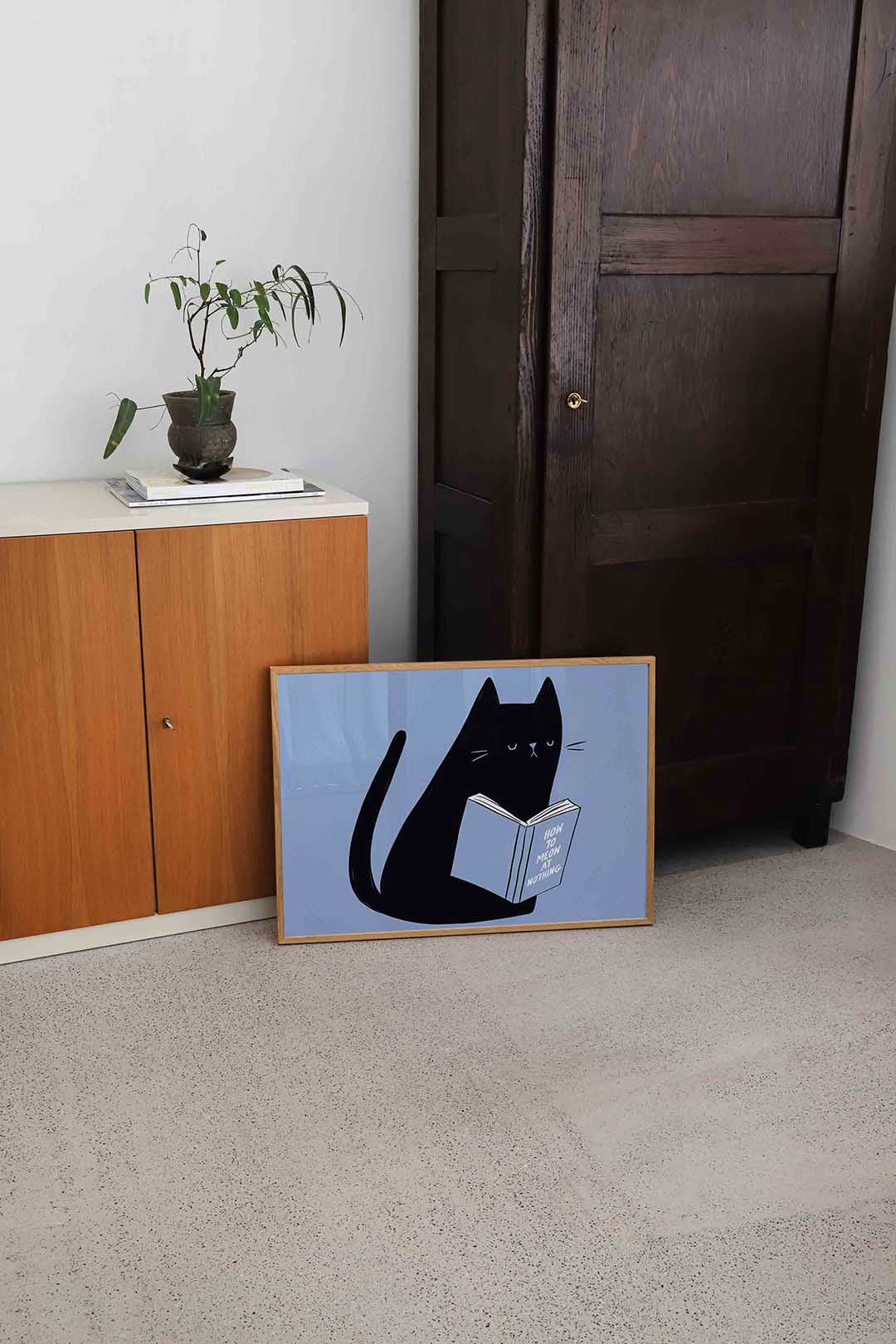 Zwarte kat met boek – hedendaagse illustratie als liggende poster