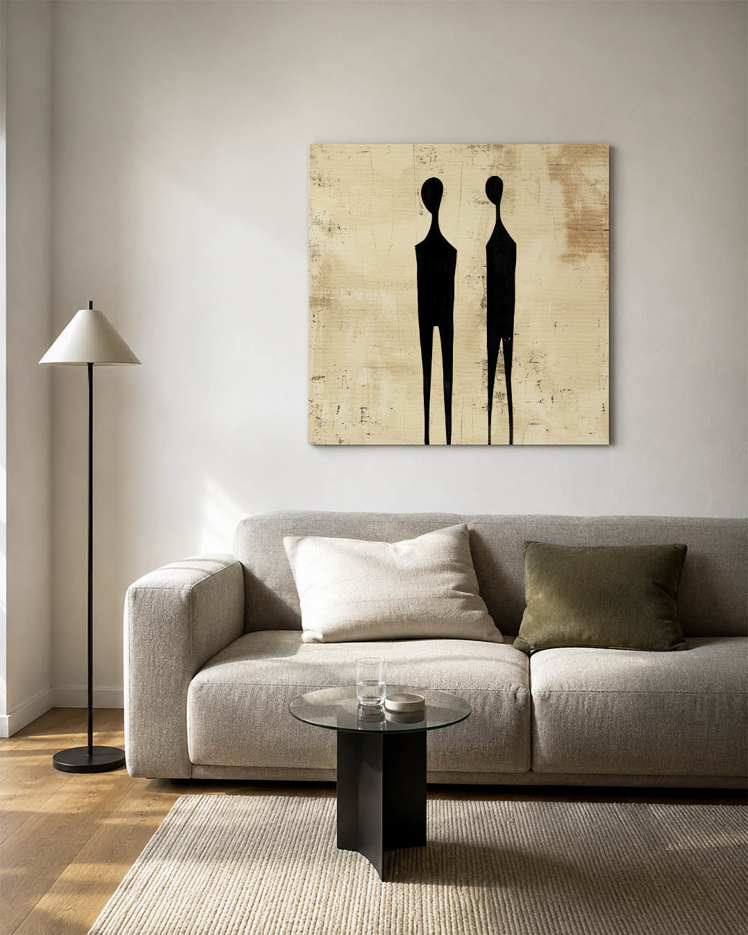 Figuren kunstwerk – vierkante wanddecoratie – twee gestileerde zwarte figuren staan op een beige achtergrond. De compositie